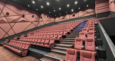 Novo Cinemas The Pearl Doha, empty theater with red seats.