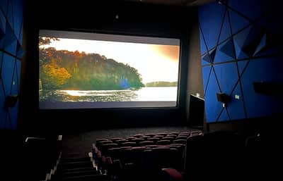 Novo Cinemas The Pearl Doha auditorium with scenic movie screen.
