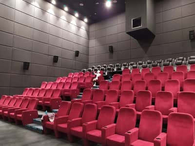 Empty red seats in Flik Cinema, Al Mirqab Mall, Doha.