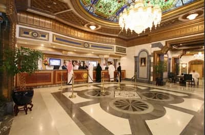 Elegant interior of Tuheed Pakistani Restaurant, Makkah with ornate ceiling.
