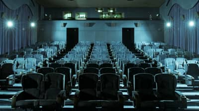 Empty theater seating at Reel Cinemas, Dubai Marina Mall.