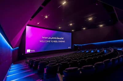 Reel Cinemas auditorium with large screen, Dubai Marina Mall.