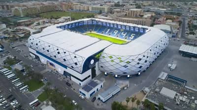 Aerial view of Al Nasr Al Maktoum Stadium, Dubai, modern architecture.
