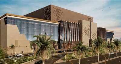 Modern Kingdom Arena Riyadh exterior with palm trees and geometric patterns.