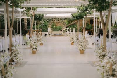 Elegant garden event setup at The Farm Restaurant, Al Barari, Dubai.