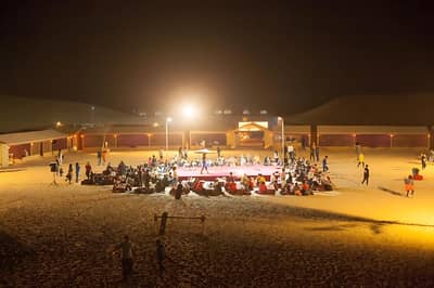 Nighttime gathering at Al Khatim Desert Safari, Abu Dhabi.