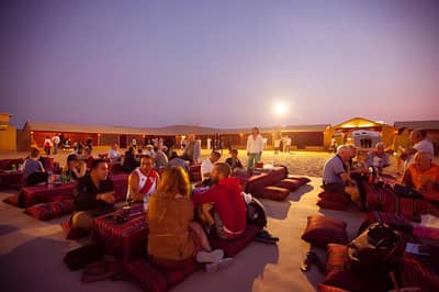 People enjoying evening at Al Khatim Desert Safari, Abu Dhabi.