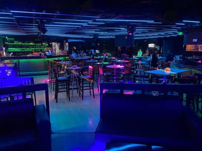 Maharlika Night Club Doha vibrant interior with neon lighting