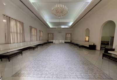 Spacious hall with chandeliers, Fatima Kanoo Hall, Manama.