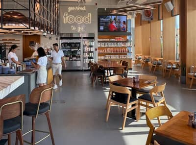 Jones the Grocer interior, modern dining area, Palm Jumeirah, Dubai.