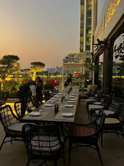 Outdoor dining setup at Trader Vic's Palm Jumeirah, Dubai.