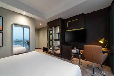 Guest room with modern decor at Holiday Inn Riyadh al Malaz by IHG, Riyadh