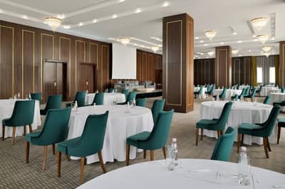Elegant event space with round tables at Holiday Inn Riyadh al Malaz, Riyadh.