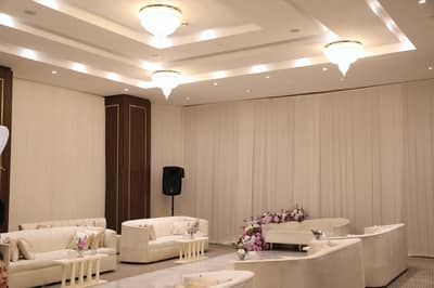 Elegant event seating with floral arrangements at Holiday Inn Riyadh al Malaz, Riyadh.