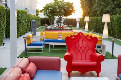 Colorful outdoor seating area at Aureum Club, Dubai, UAE