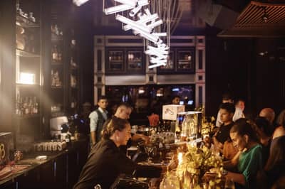 Bar area with patrons at Nazcaa Japanese Peruvian Dubai, Dubai, UAE
