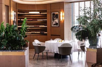Elegant dining area with wine display at LaFamiglia Dubai, Dubai, UAE