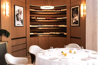 Elegant dining area with wine display at LaFamiglia Dubai, Dubai, UAE