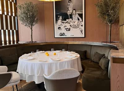 Elegant dining area with round table at LaFamiglia Dubai, Dubai, UAE