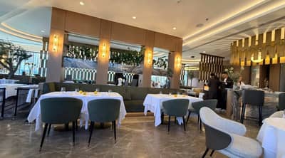 Elegant dining area with tables and chairs at LaFamiglia Dubai, Dubai, UAE.