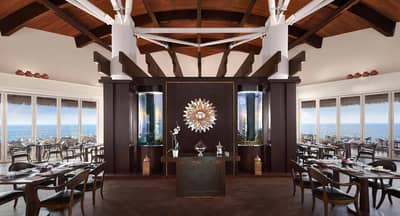 Elegant dining area with ocean view at Banana Island Resort Doha By Anantara, Qatar.