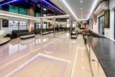 Luxurious interior with modern seating and lighting at Royal Rave Yacht, Dubai, UAE