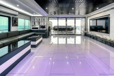 Luxurious interior with seating and ocean view at Royal Rave Yacht, Dubai, UAE