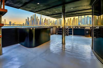 Spacious deck with city skyline view at Royal Rave Yacht, Dubai, UAE