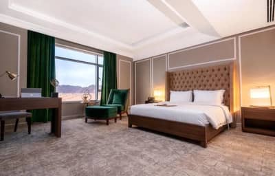 Elegant guest room with mountain view at Sukani Royal Hotel Hail, Saudi Arabia.