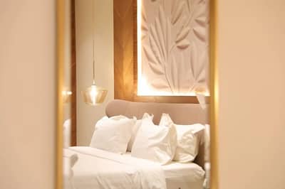 Elegant guest room with plush bedding at Suknai Resort Riyadh, Saudi Arabia.