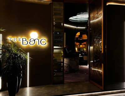 Entrance with illuminated sign at The Banc Dubai, Dubai, UAE