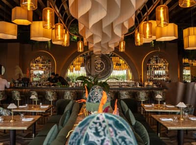 Elegant dining area with bar and decorative lighting at The Banc Dubai, UAE