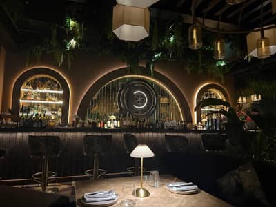 Elegant bar interior with ambient lighting at The Banc Dubai, Dubai, UAE