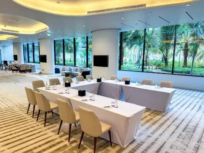 Elegant conference room with large windows at Voco Dubai Nice, Dubai, UAE