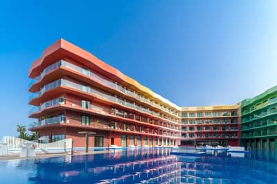 Colorful building and pool at Voco Dubai Nice The Heart of Europe, Dubai, UAE