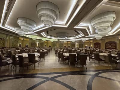 Elegant banquet hall with chandeliers at H Laylati Event Venue, Madinah, Saudi Arabia.
