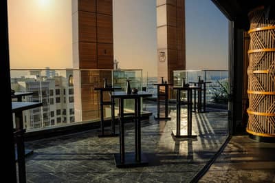 Outdoor terrace with tables at Asia Asia The Palm, Dubai, UAE.