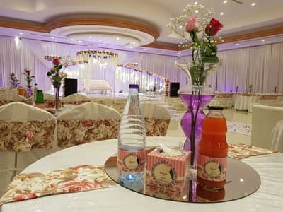 Elegant event setup with floral decor at Sadeem Celebrations Hall Abha, Saudi Arabia.
