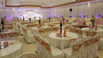 Elegant event setup with floral decor at Sadeem Celebrations Hall Abha, Saudi Arabia.