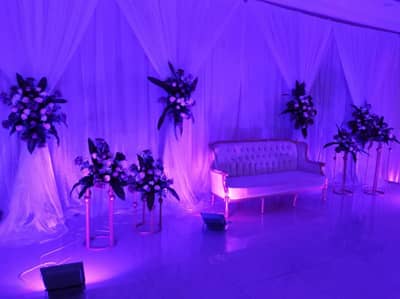 Elegant floral arrangement and sofa at Sadeem Celebrations Hall Abha, Saudi Arabia