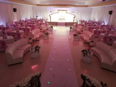 Elegant event setup with pink decor at Sadeem Celebrations Hall Abha, Saudi Arabia.