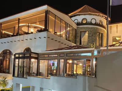 Elegant exterior of Soul Restaurant Al Bahah, Al Bahah, Saudi Arabia at night.