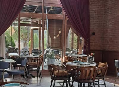 Elegant dining area with wooden chairs at Soul Restaurant Al Bahah, Al Bahah, Saudi Arabia.