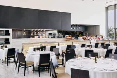 Elegant dining setup at Estiatorio Milos Dubai, Dubai, UAE