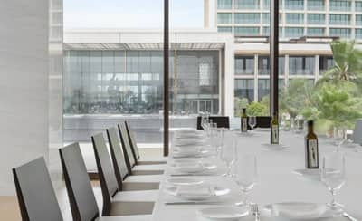 Elegant dining setup at Estiatorio Milos Dubai, Dubai, UAE