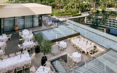 Elegant outdoor dining area at Estiatorio Milos Dubai, Dubai, UAE