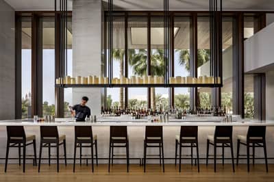 Elegant bar area with bartender at Estiatorio Milos Dubai, Dubai, UAE