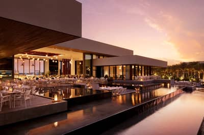Elegant outdoor dining area at Estiatorio Milos Dubai, Dubai, UAE during sunset.