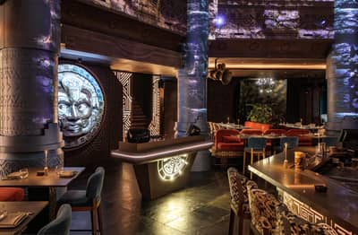 Elegant interior with decorative columns and seating at AMARU Dubai, Dubai, UAE.