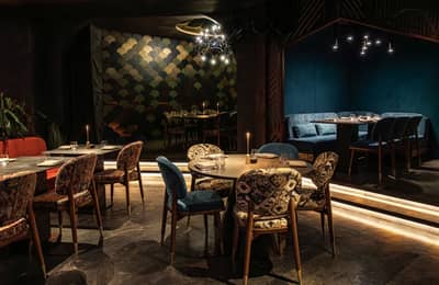 Elegant dining area with patterned chairs at AMARU Dubai, Dubai, UAE